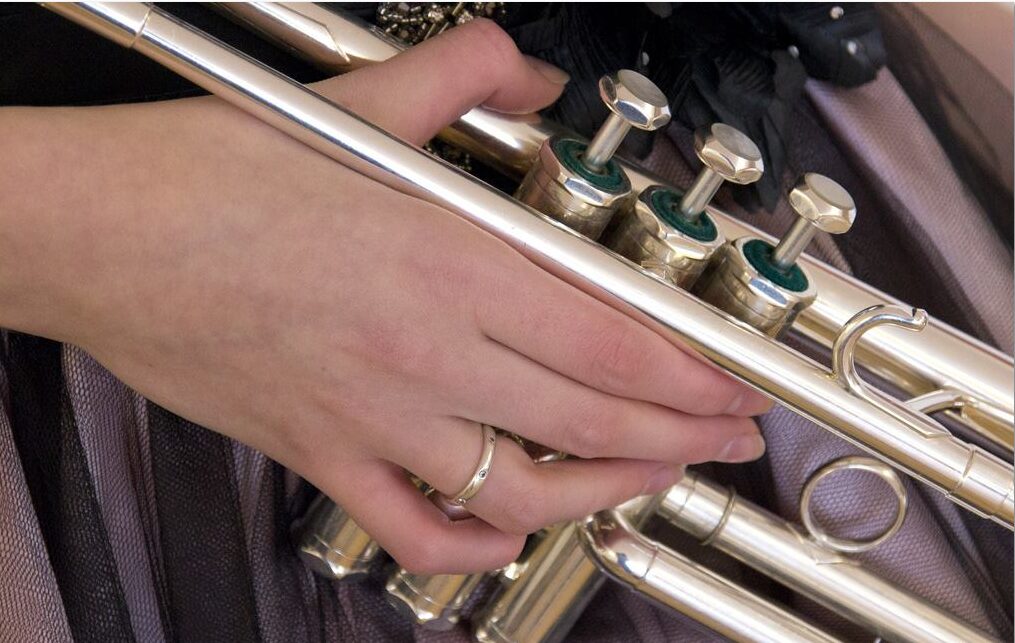 Close-up of Jem Andrews playing a silver trumpet