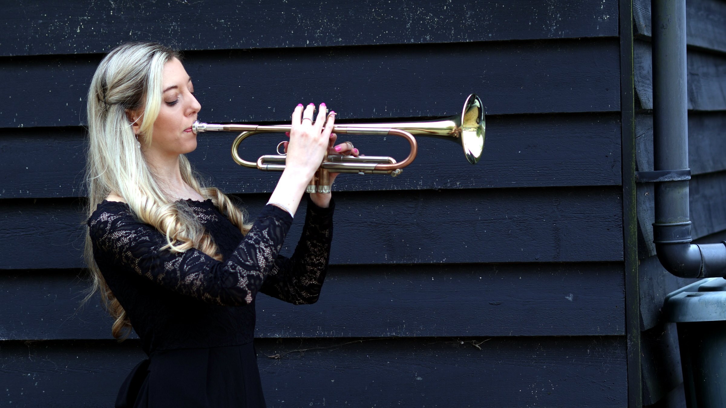 Jemma Andrews with trumpet — Projects hero image.